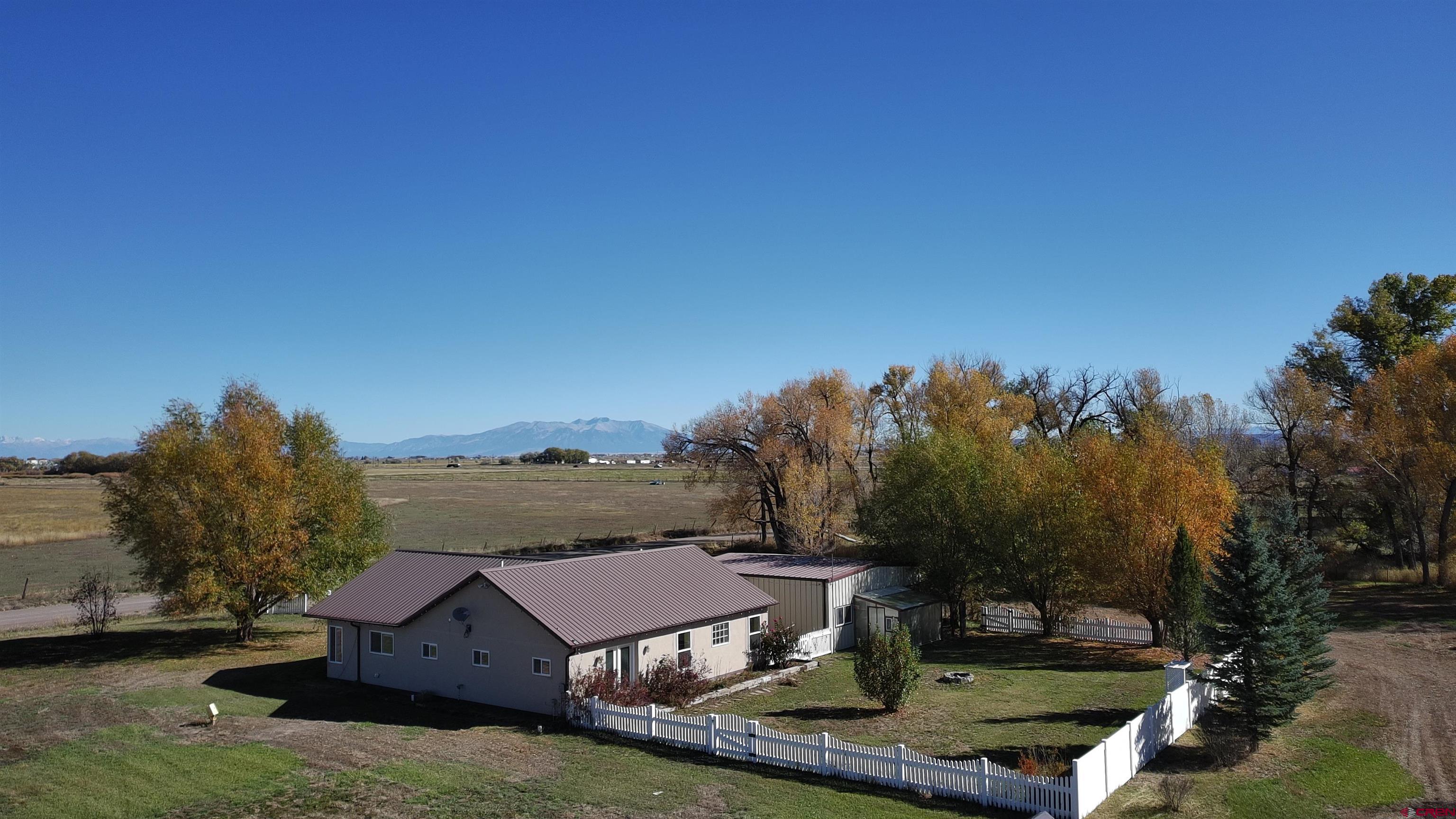 15334 County Rd T.5 La Jara, CO 81140 - Photo 4 of 28 a view of a house with a big yard