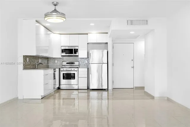 a view of a house with a ocean from a balcony