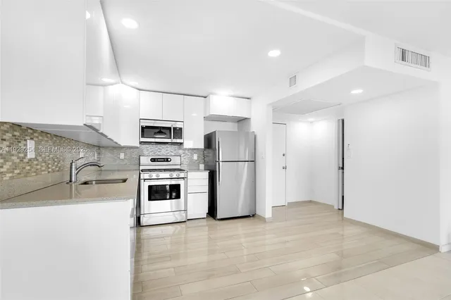 a view of a golf course with a lake