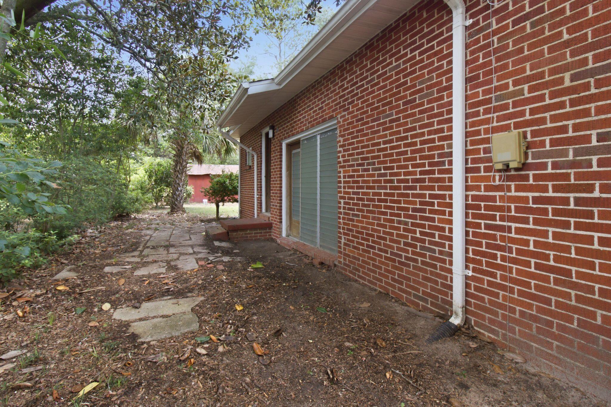 855 North Pearl Street Crestview, FL 32536 - Photo 13 of 31 a view of a house with a backyard