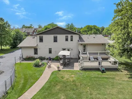 a view of a house with a yard porch and sitting area
