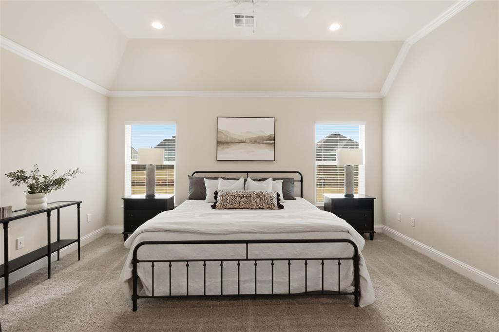 330 Prien Lk Loop Bossier City, LA 71111 - Photo 13 of 28 a bedroom with a large bed and a painting on the wall