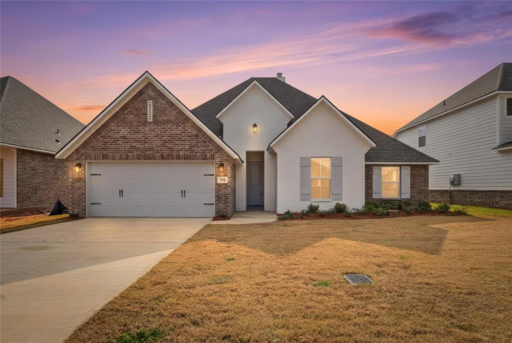 330 Prien Lk Loop Bossier City, LA 71111 - Photo 2 of 28 a view of a house with a yard and large tree