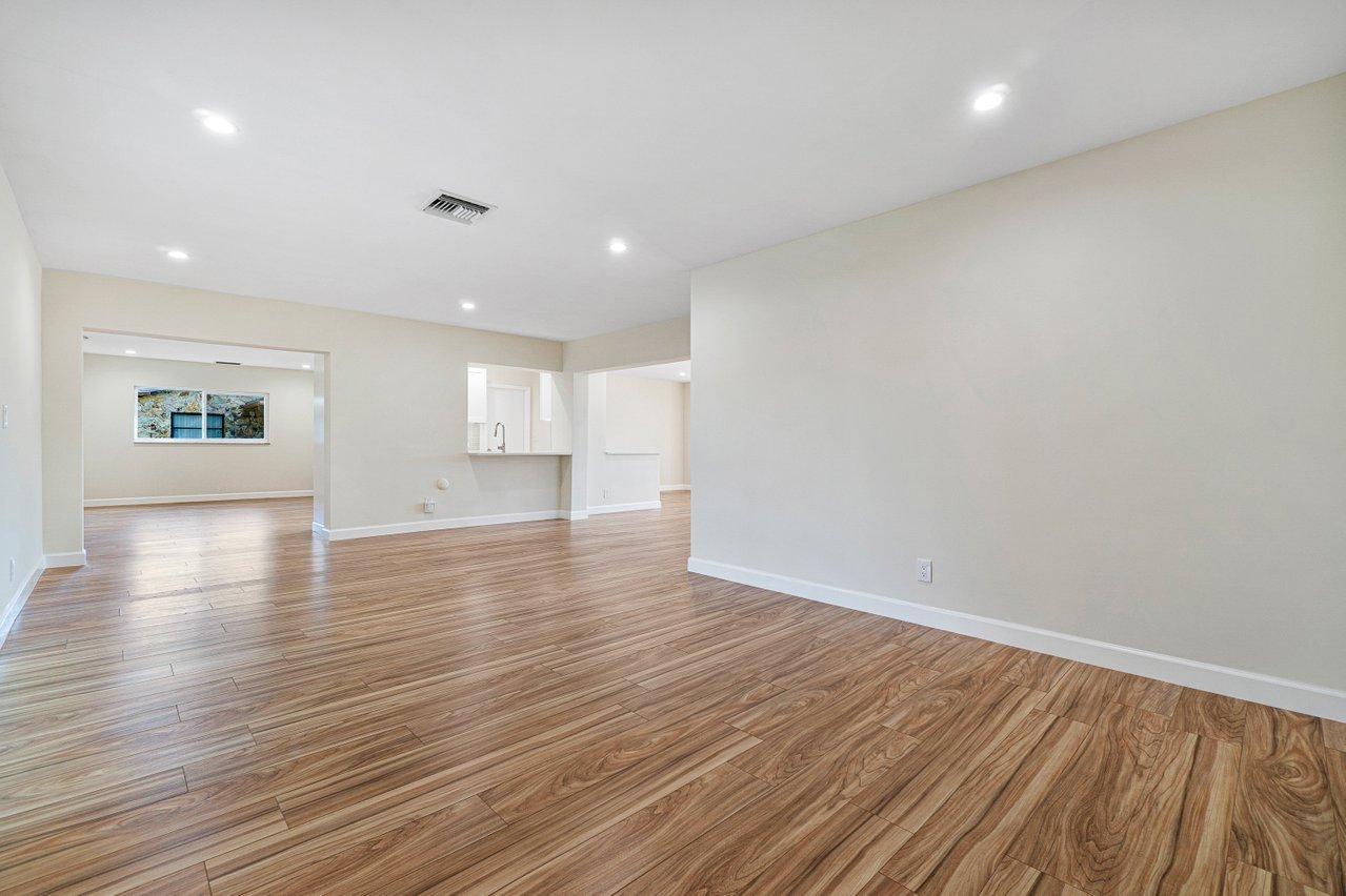 6359 Winding Brook Way Delray Beach, FL 33484 - Photo 11 of 24 a view of empty room with wooden floor