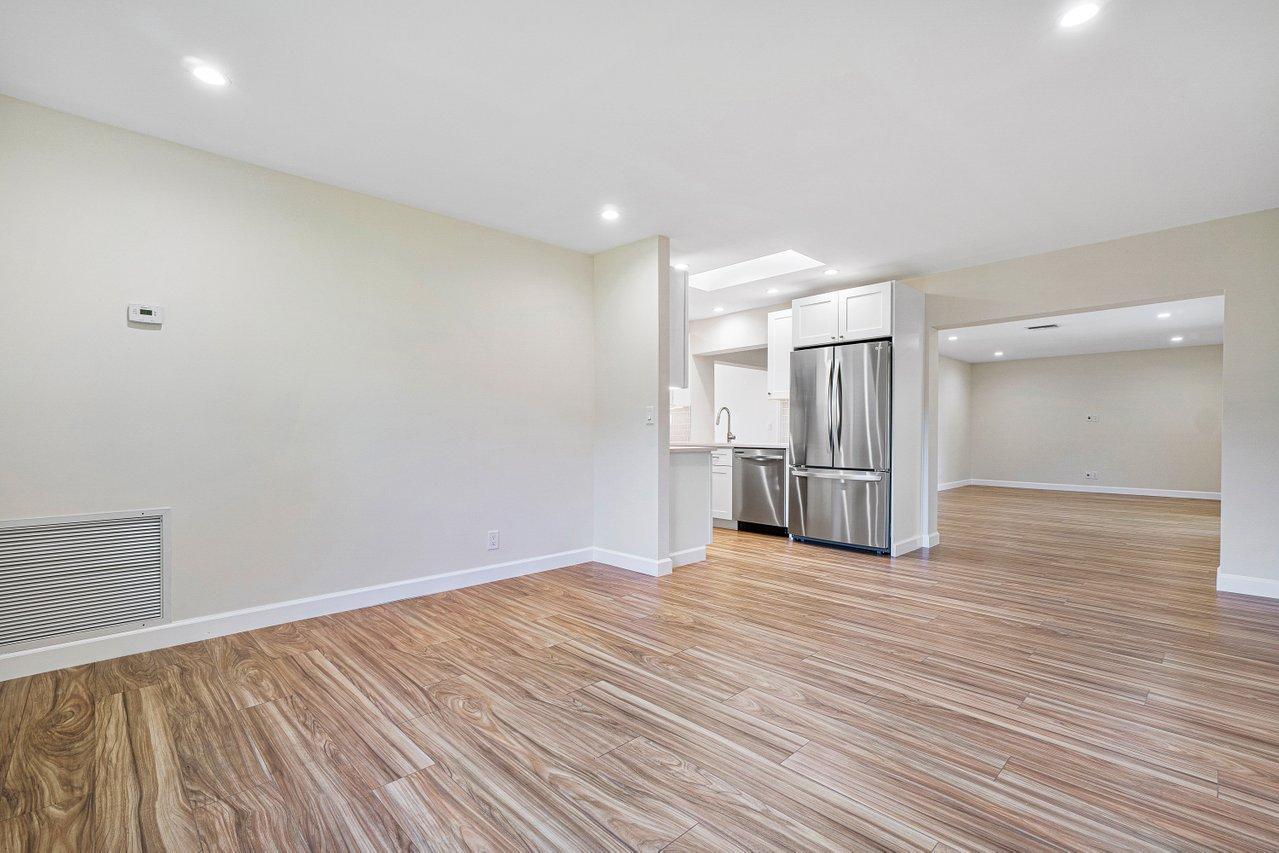 6359 Winding Brook Way Delray Beach, FL 33484 - Photo 12 of 24 a view of a room with wooden floor