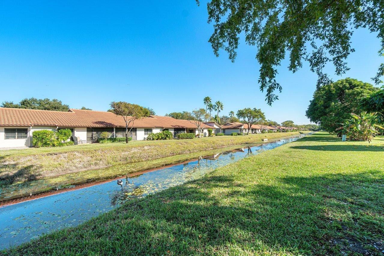 6359 Winding Brook Way Delray Beach, FL 33484 - Photo 19 of 24 a view of an outdoor space and a lake view