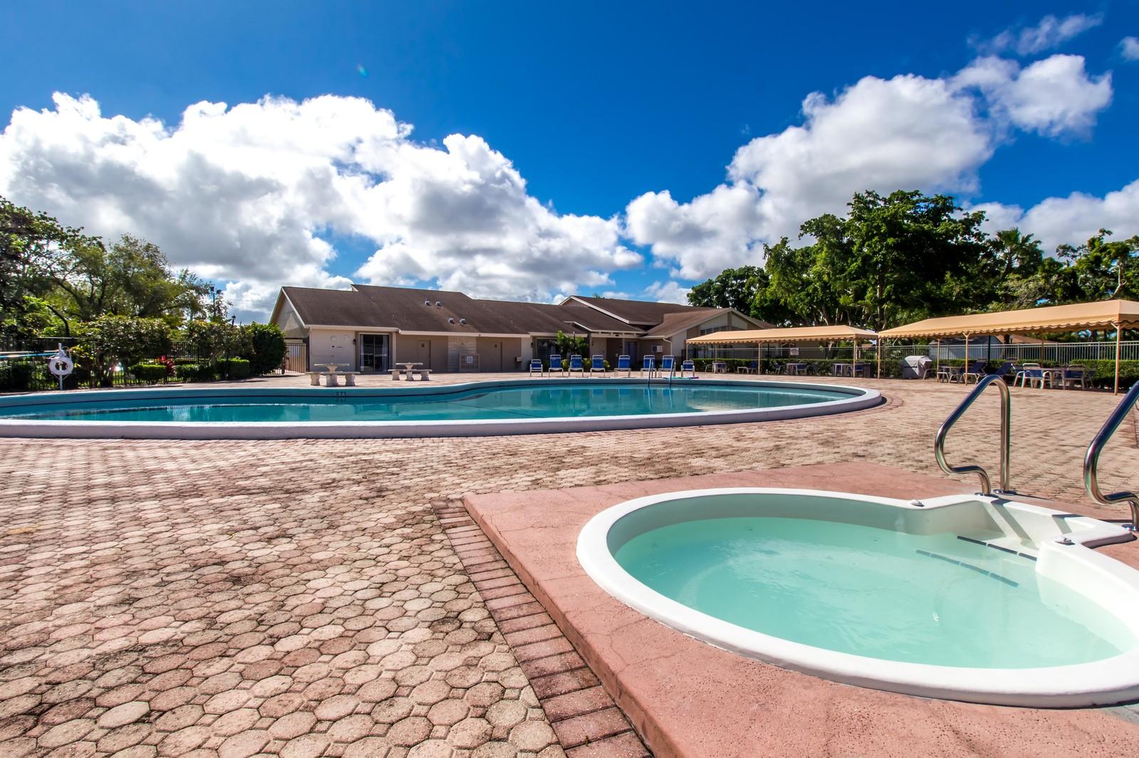 6359 Winding Brook Way Delray Beach, FL 33484 - Photo 23 of 24 a view of swimming pool with seating space