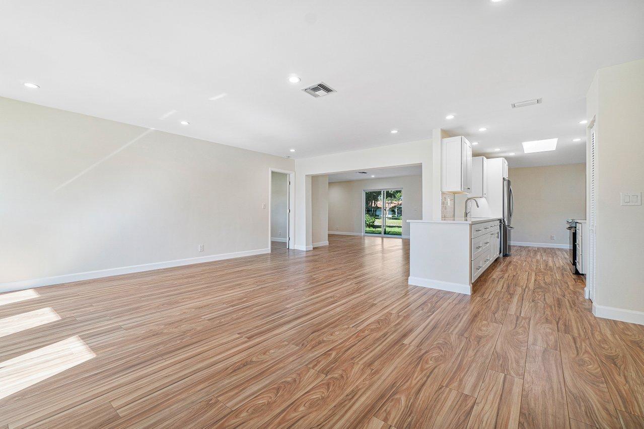 6359 Winding Brook Way Delray Beach, FL 33484 - Photo 5 of 24 a view of empty room with wooden floor