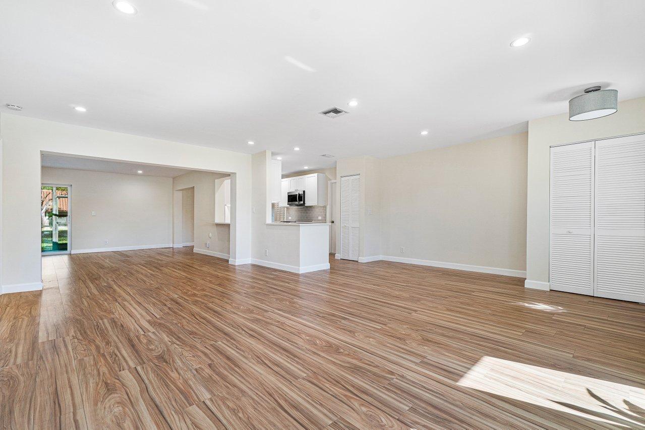 6359 Winding Brook Way Delray Beach, FL 33484 - Photo 6 of 24 a view of empty room with wooden floor