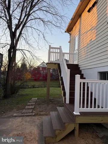 a view of a deck with a yard