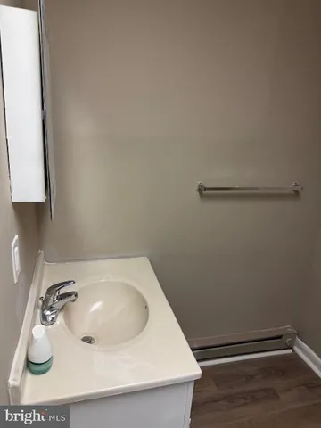 a bathroom with a sink and vanity