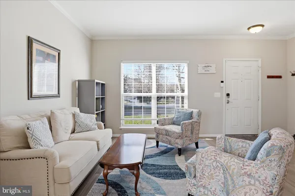 a living room with furniture and a table