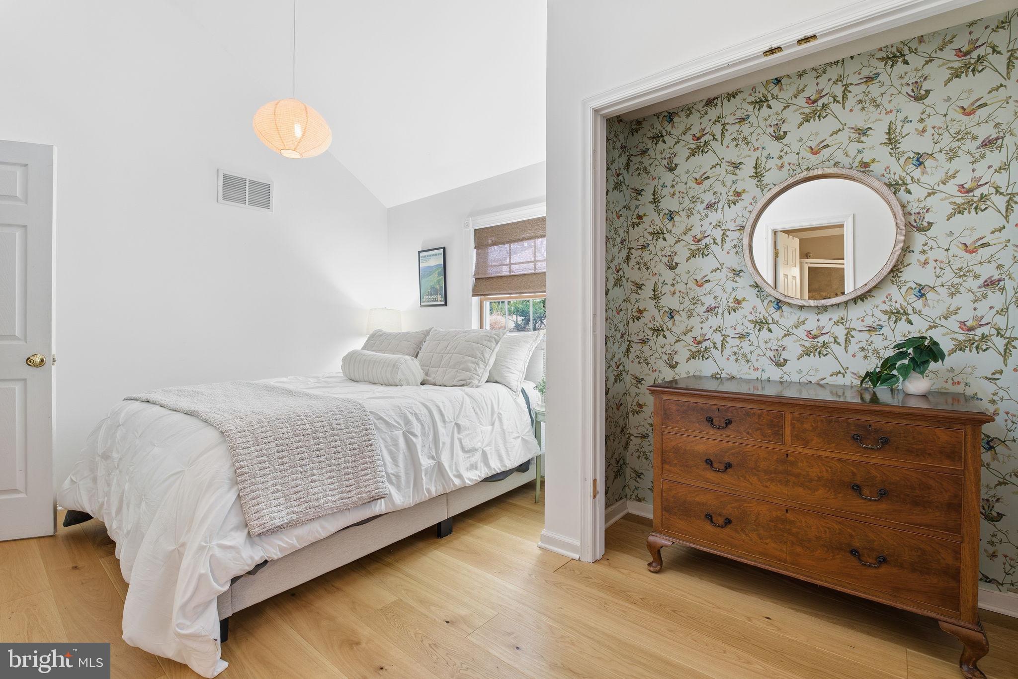 1446 Ridgeway Arnold, MD 21012 - Photo 18 of 41 a spacious bedroom with a bed and a dresser