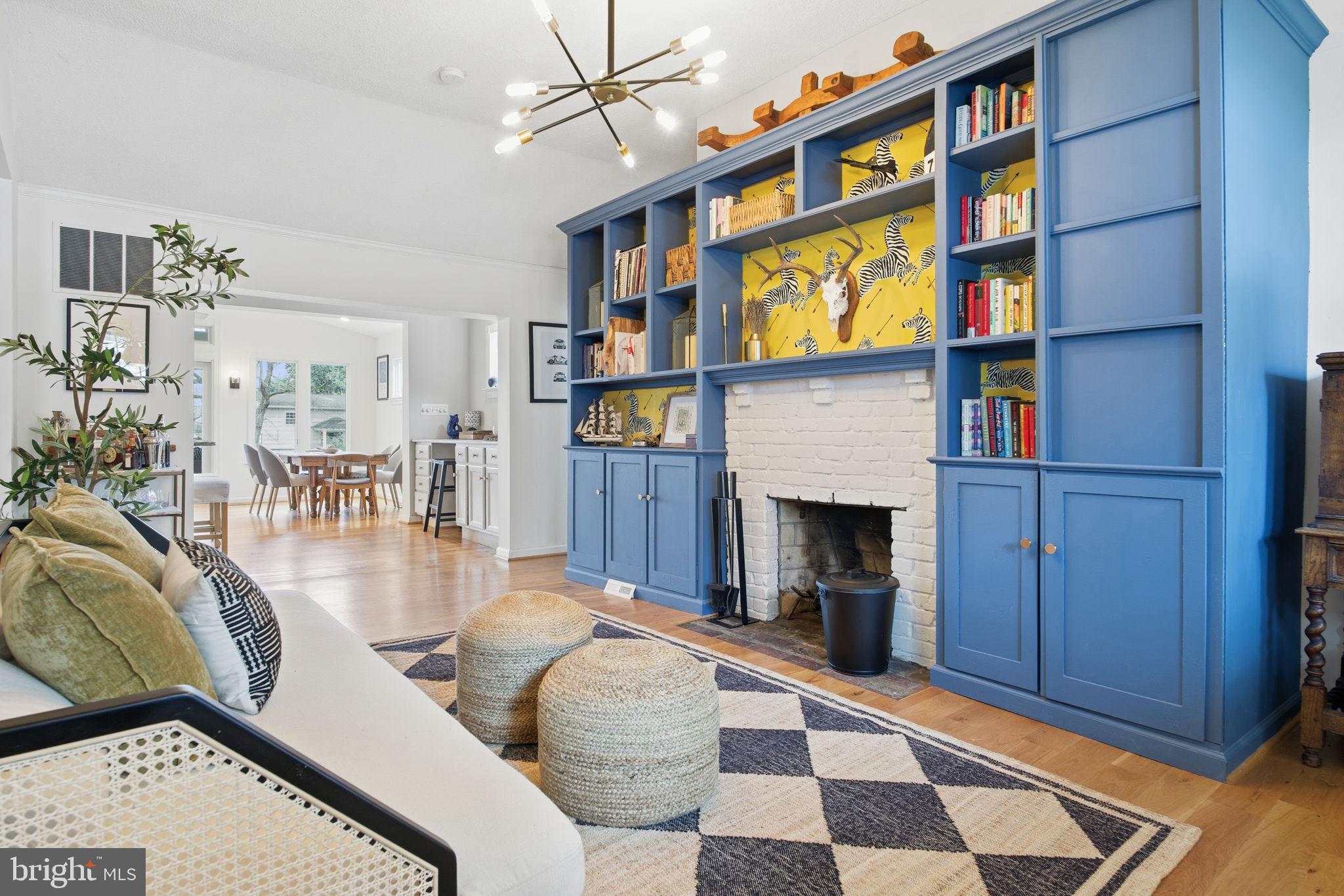 1446 Ridgeway Arnold, MD 21012 - Photo 3 of 41 a living room with furniture a fireplace and a book shelf