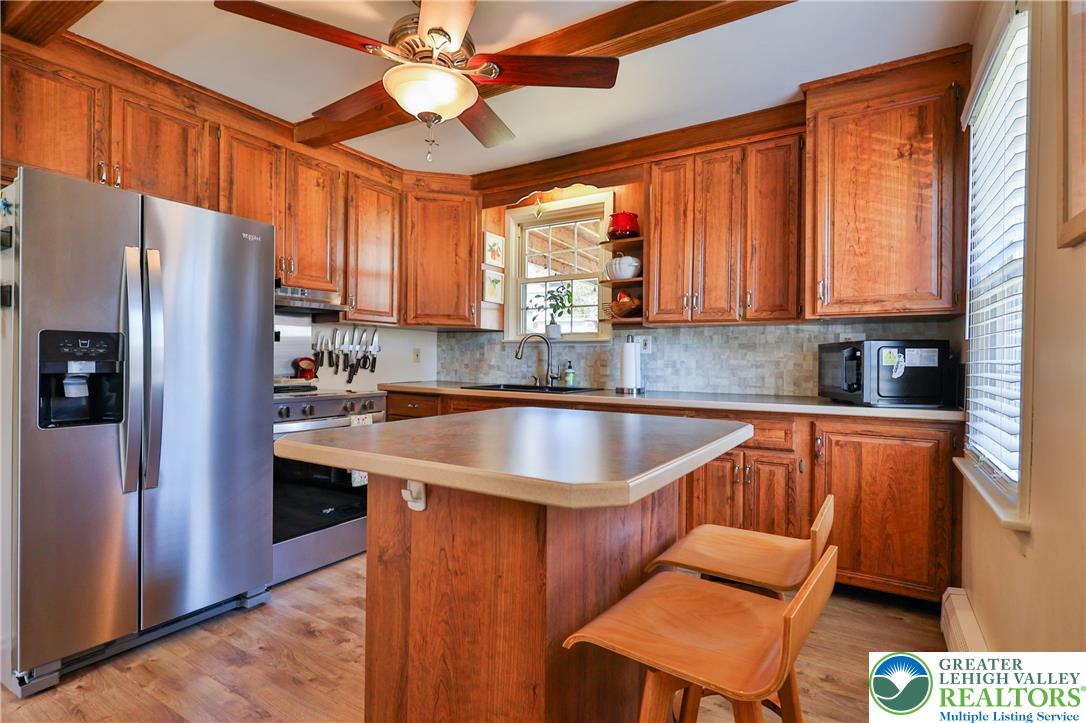 851 Media Street Bethlehem, PA 18017 - Photo 11 of 22 a kitchen with stainless steel appliances granite countertop a sink stove and refrigerator
