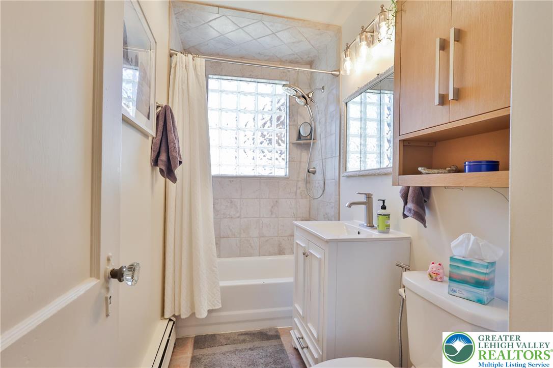 851 Media Street Bethlehem, PA 18017 - Photo 14 of 22 a bathroom with a sink toilet vanity and tub