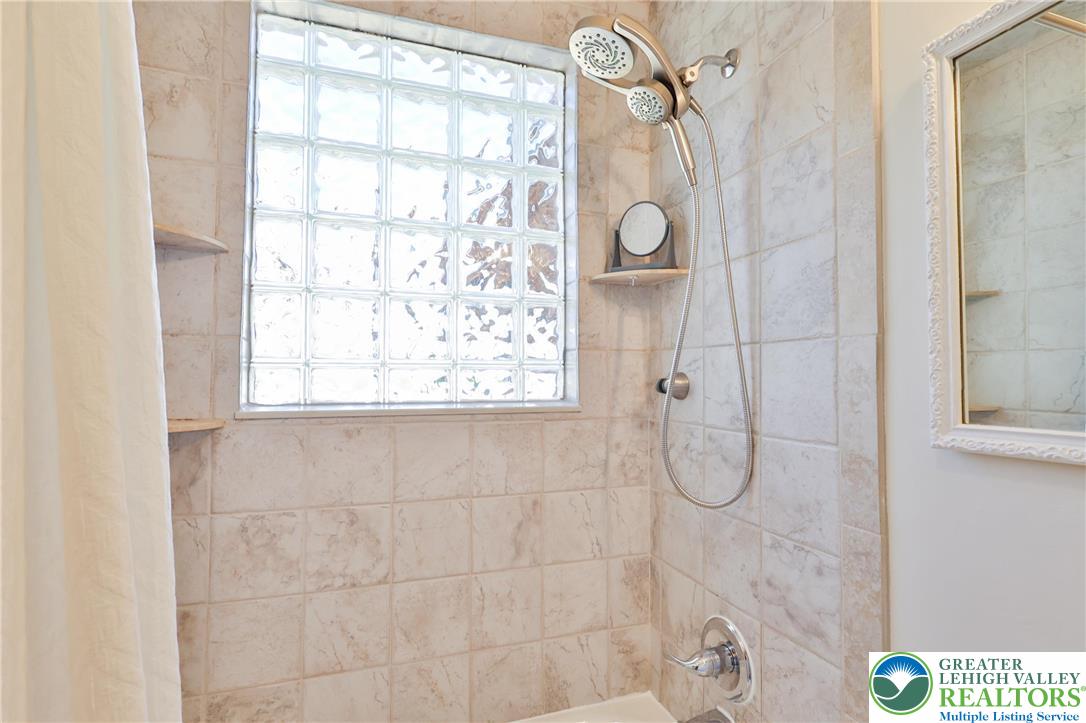 851 Media Street Bethlehem, PA 18017 - Photo 15 of 22 a bathroom with a glass shower door