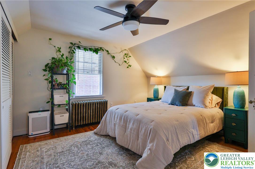 851 Media Street Bethlehem, PA 18017 - Photo 16 of 22 a bedroom with a bed and a chandelier