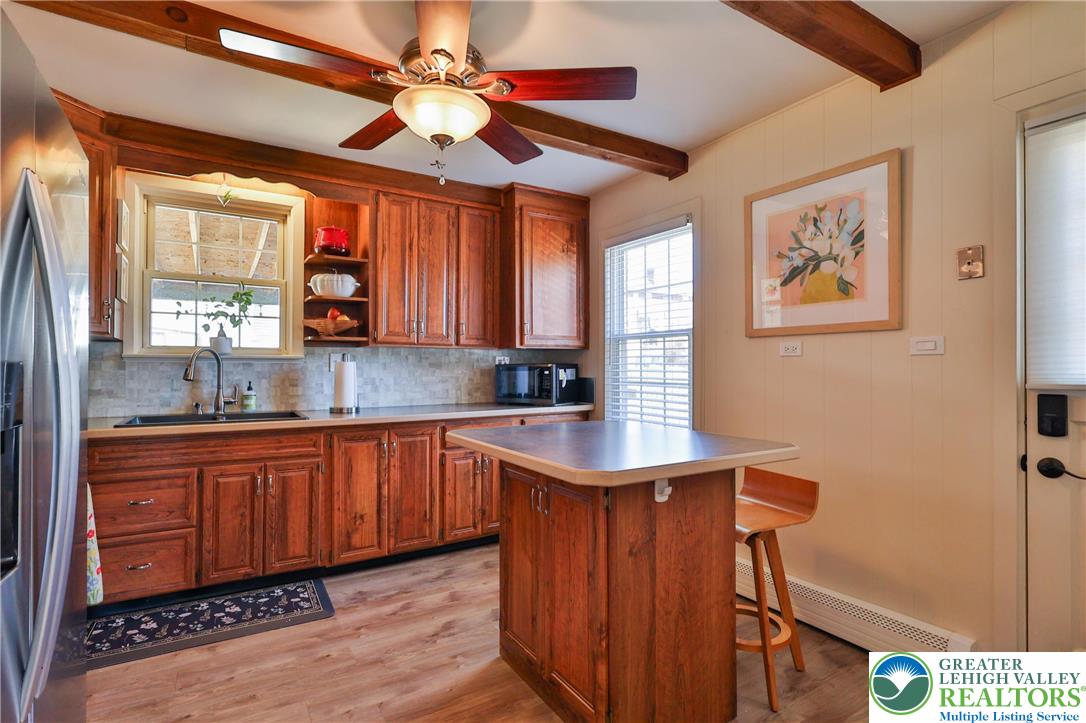 851 Media Street Bethlehem, PA 18017 - Photo 10 of 22 a kitchen with stainless steel appliances granite countertop a sink a stove cabinets and wooden floor
