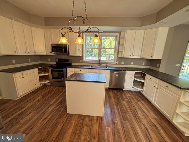 788 Paulsboro Road Swedesboro, NJ 08085 - Photo 2 of 15 a kitchen with kitchen island granite countertop wooden floors stainless steel appliances and sink