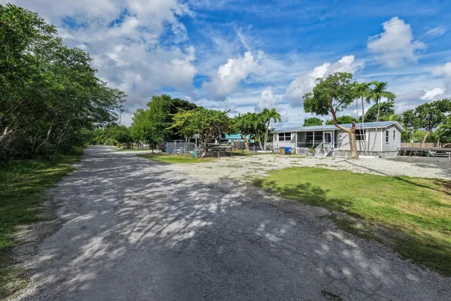 a view of swimming pool is middle and garden