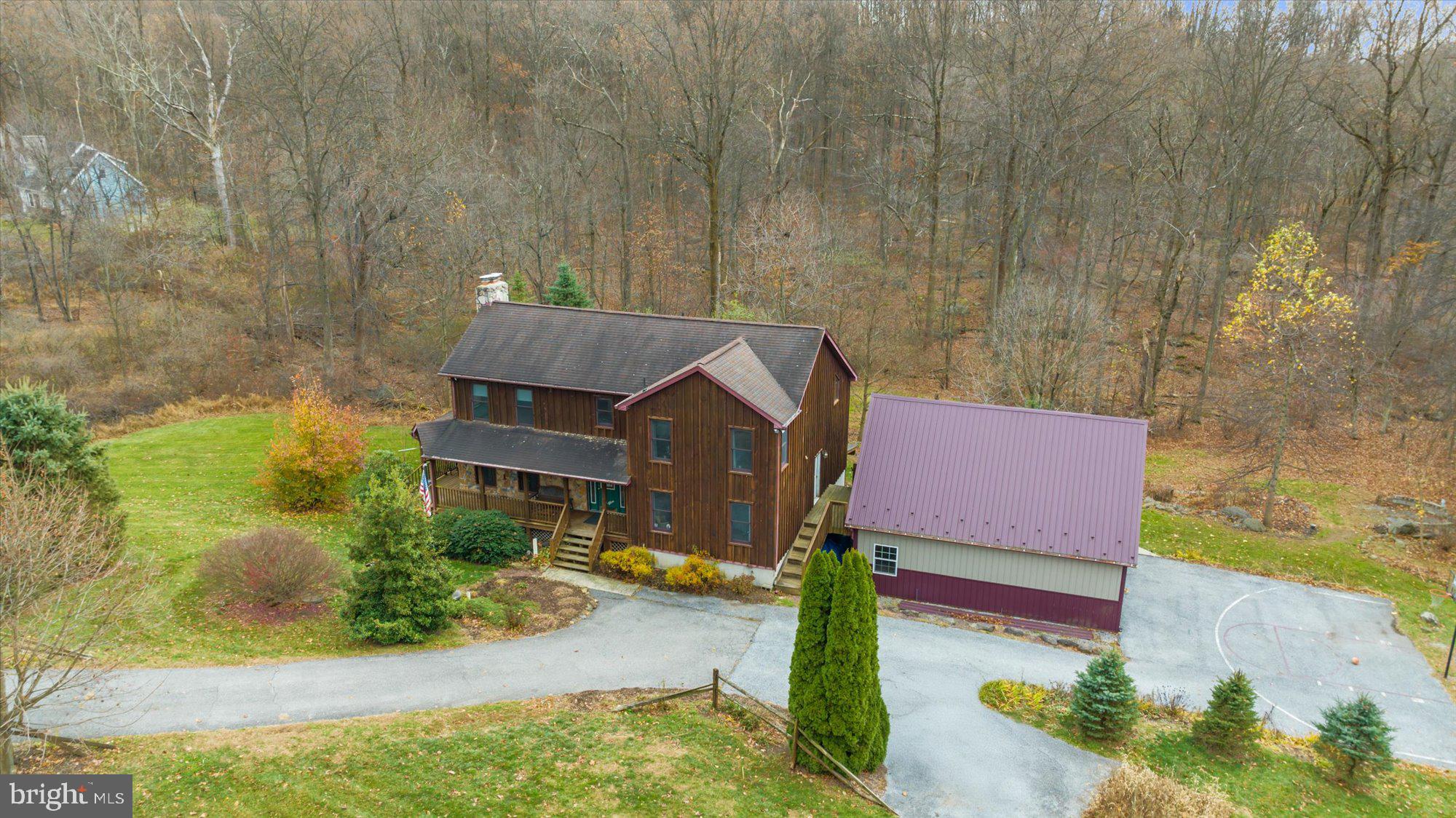 a aerial view of a house with a yard