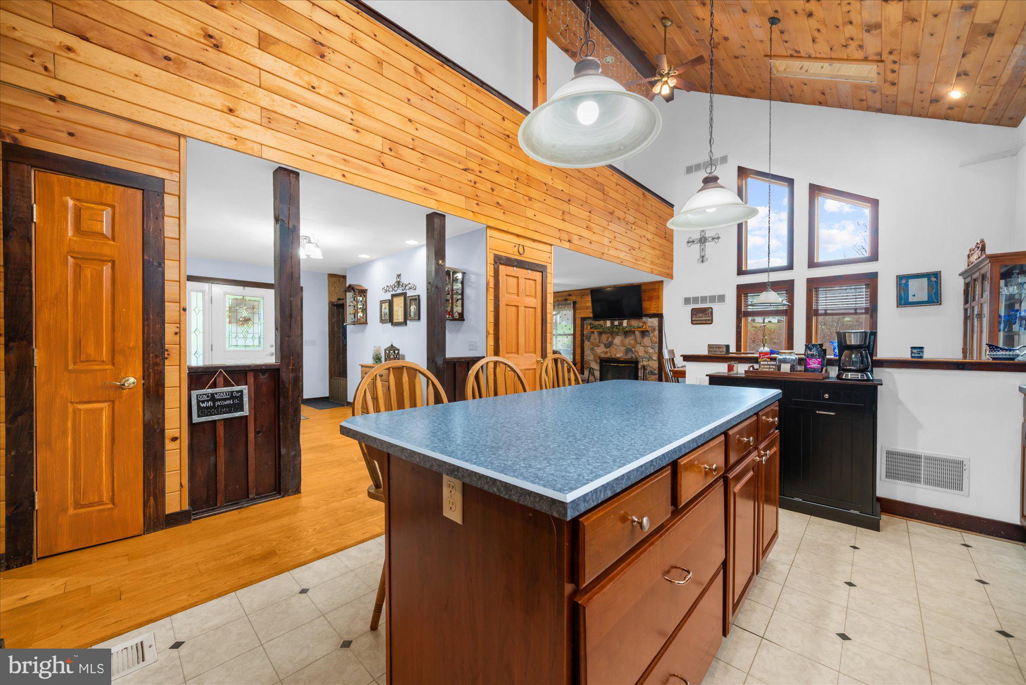 28 Highview Lane Mertztown, PA 19539 - Photo 11 of 57 a kitchen with stainless steel appliances granite countertop a kitchen island a refrigerator and a sink