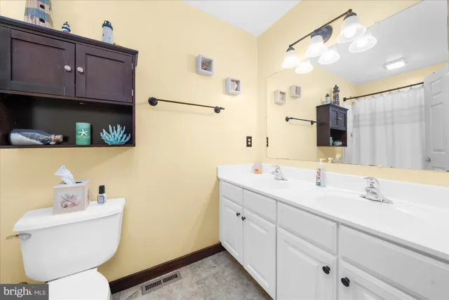 a bedroom with a bed and cabinets