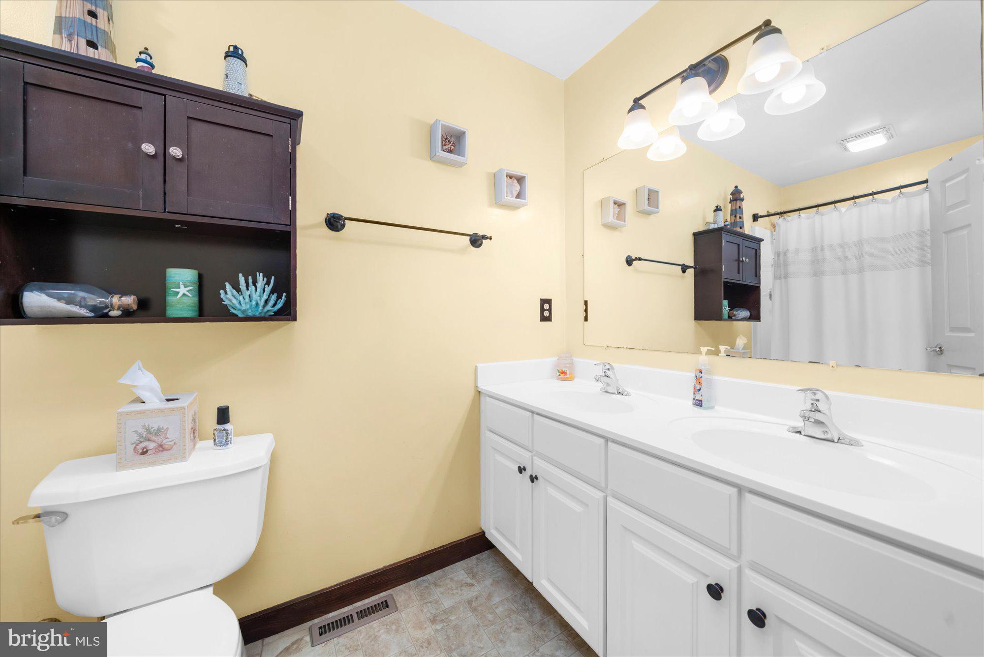28 Highview Lane Mertztown, PA 19539 - Photo 21 of 57 a bathroom with a toilet sink and mirror