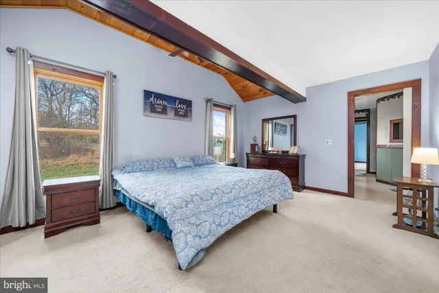a bathroom with a tub and shower