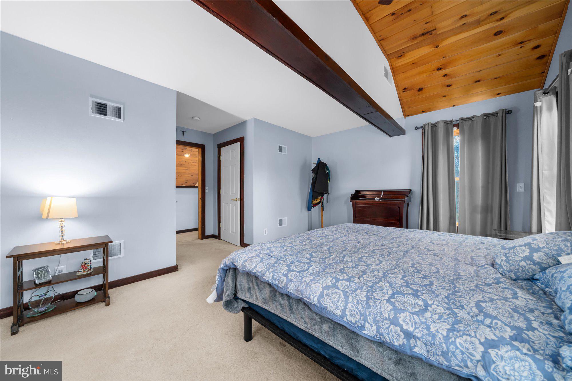 28 Highview Lane Mertztown, PA 19539 - Photo 28 of 57 a spacious bedroom with a bed and a dresser in it