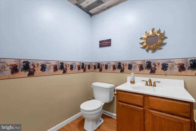 a room with pool table and windows