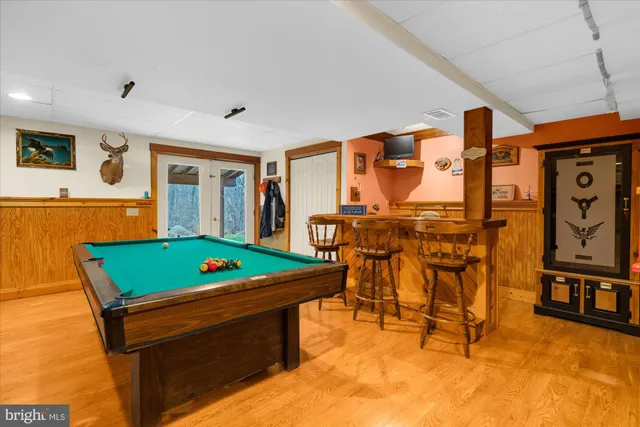 a living room with furniture and gym equipment