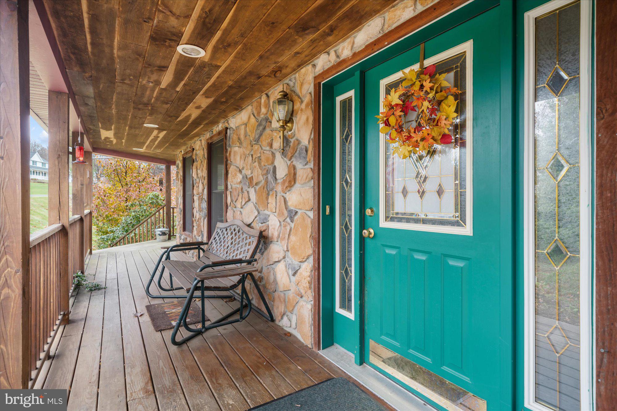 28 Highview Lane Mertztown, PA 19539 - Photo 4 of 57 a view of a balcony with chairs and furniture