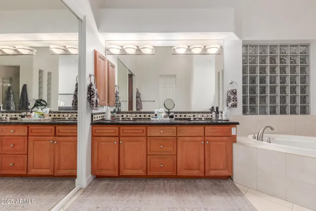 a view of a room with a window and a ceiling fan