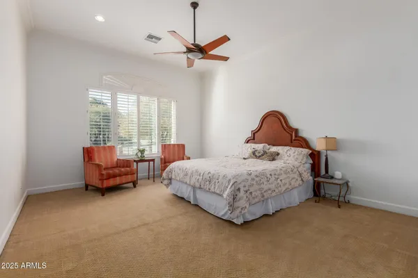 a view of an empty room with a cabinet and a flat screen tv