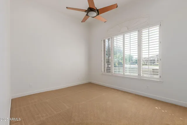 an aerial view of a house with a mountain view