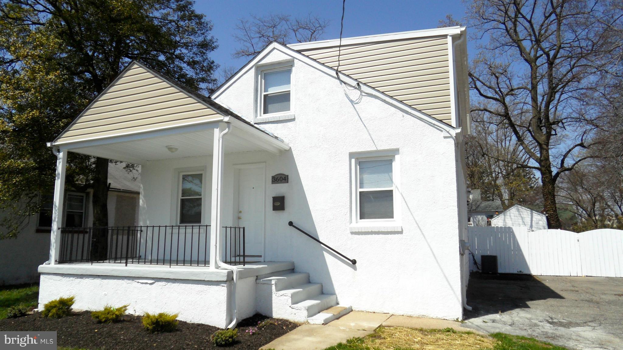 3604 Florida Road Baltimore, MD 21244 - Photo 1 of 28 a view of a white house with large windows