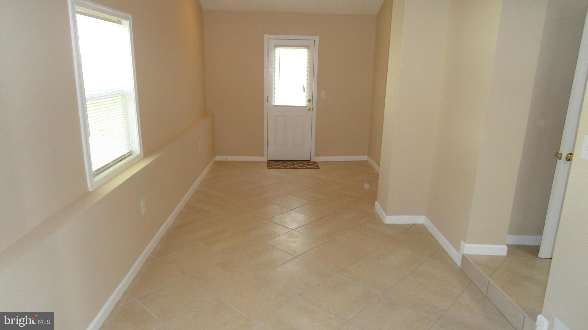 3604 Florida Road Baltimore, MD 21244 - Photo 8 of 28 an empty room with windows