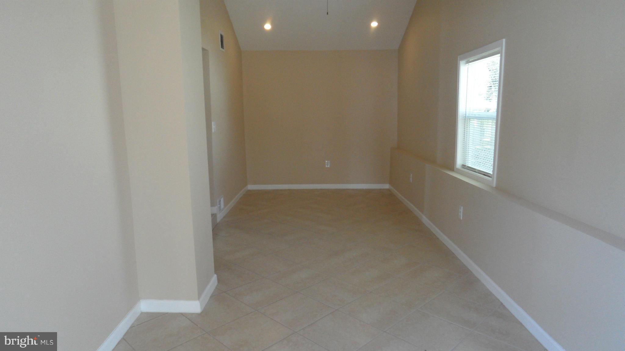 3604 Florida Road Baltimore, MD 21244 - Photo 9 of 28 an empty room with windows