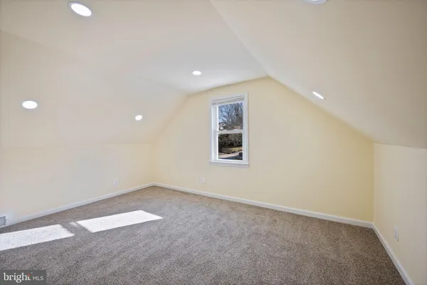 an empty room with a empty space and window