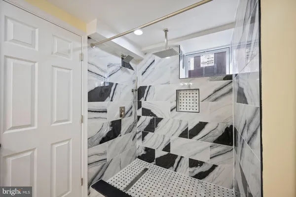 a view of a livingroom with wooden floor and white walls