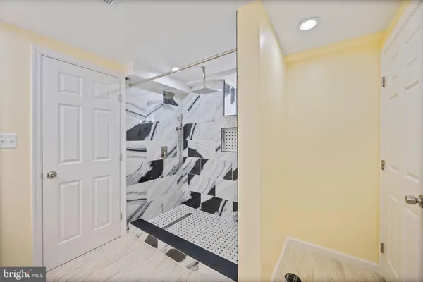 a view of entryway with stairs and wooden floor