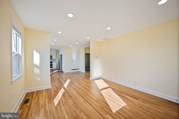 a view of bedroom with wooden floor