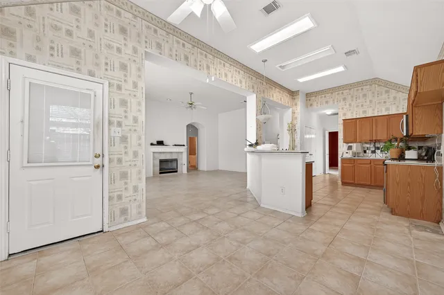 a view of a kitchen with furniture and an open kitchen view