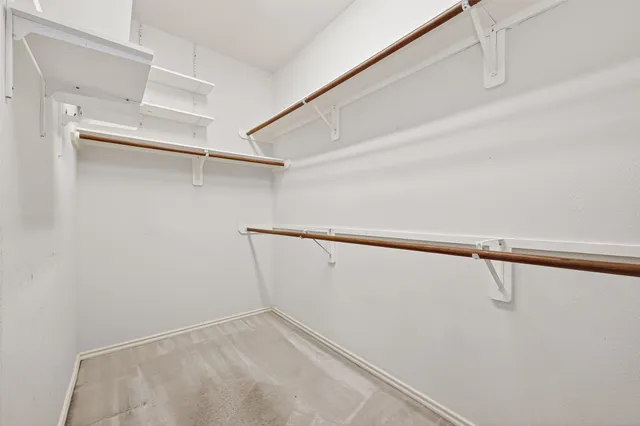 a view of an empty walk in closet