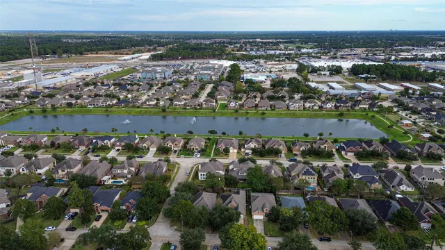 an aerial view of city and lake