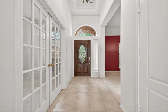 a view of a hallway with entryway front door
