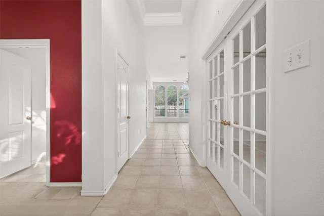 a view of a hallway with windows