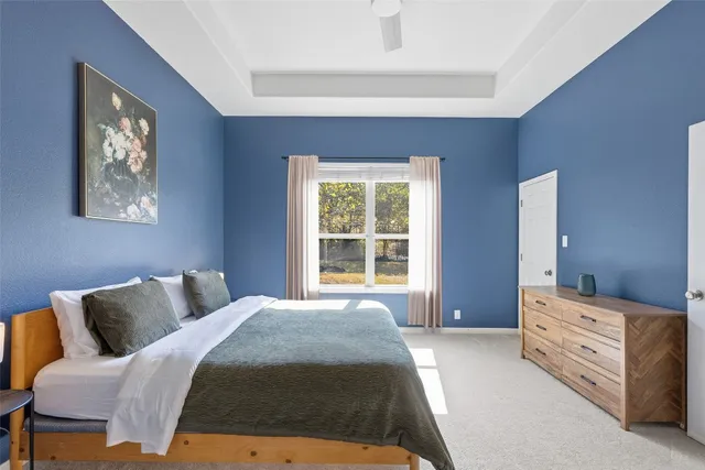 a kitchen with kitchen island granite countertop a sink stove and refrigerator